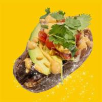 Chicken Fiesta · Giant Potato cloud-fluffed inside & stuffed with shredded chicken, topped with diced Tomato,...