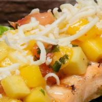 Lettuce Wrap Salmon Taco · Charbroiled salmon topped with your choice of pineapple or mango salsa and cheese, wrapped i...
