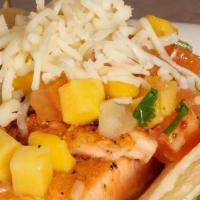 Salmon Taco · Charbroiled salmon topped with fresh mango salsa and cheese.