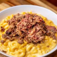 Meaty Mac · Mac and cheese topped with your choice of meat.
