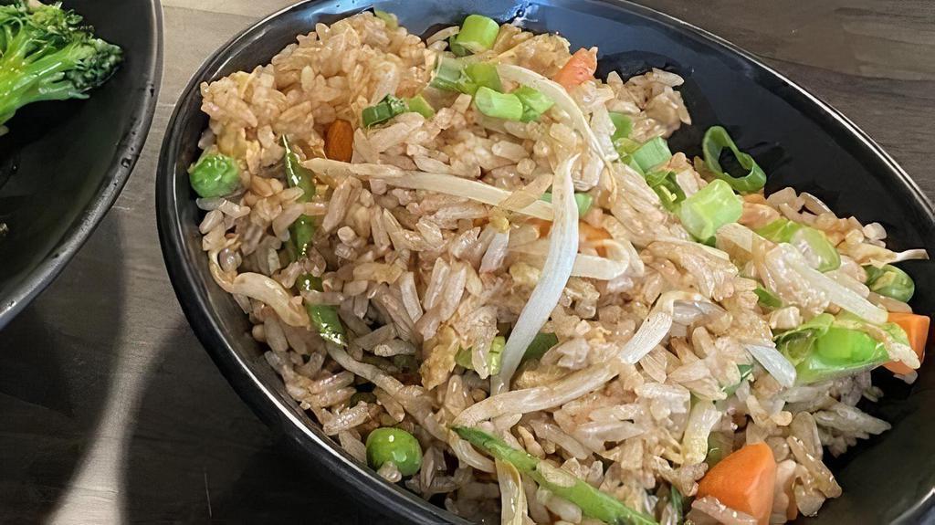 Fried Rice · Stir-fried rice with your choice of protein (pork, beef, jumbo/baby shrimp) or vegetables with green peas and diced carrots.