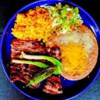 Carne Asada · Thinly sliced, seasoned skirt steak, carefully charbroiled perfection. Garnished with whole ...