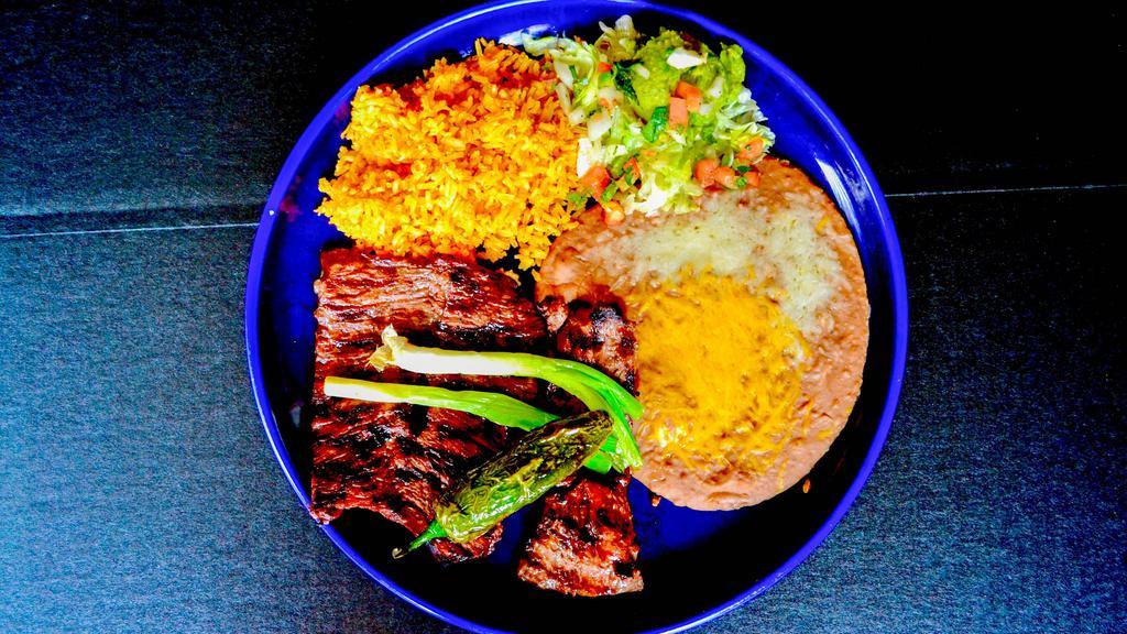 Carne Asada · Thinly sliced, seasoned skirt steak, carefully charbroiled perfection. Garnished with whole green onions fried jalapeno Pepper and guacamole.