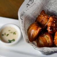 Brewhouse Soft Pretzel · Served with a creamy beer cheese sauce & sweet mustard