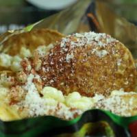 Tosti Elotes Grandes · Tostitos, corn, mayonnaise, butter, lime and chili
