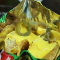 Tosti Nachos · Tostitos, nacho cheese and jalapeños