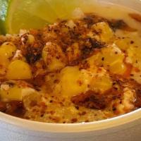 Esquite / Corn In A Cup · Delicious corn with cheese, tajin spicy chili powder, and mayonnaise.