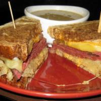 Pastrami Reuben · Grilled pastrami, saur kraut and swiss cheese with thousand islands spread on grilled marble...