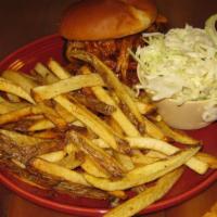 The Pulled Pig · Slow smoked pulled pork with BBQ sauce and coleslaw on a grilled brioche bun.

Consuming raw...