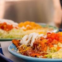 Enchilada Plate · 3 Enchiladas. Served with Mexican refried beans, rice, lettuce, tomatoes, sour cream and che...