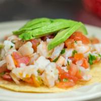 Shrimp Fajita Burrito · 12 tiger shrimp bell peppers onions tomatoes sour cream avocado sauce rice refried beans