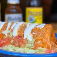 Chile Relleno Burrito · California chile stuffed with Monterey Jack cheese and dipped in our batter with Mexican ref...