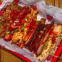 Pit Special · St. Louis ribs, pork, brisket, chicken, hot link. Three sides.