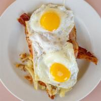 Round House · Egg, ham, cheese, bacon and sausage layered on hashbrowns & toast.