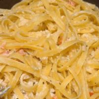 Fettuccine Alfredo · Creamy alfredo Sauce served over fettuccine Pasta. Add chicken for an additional charge.
