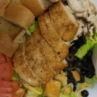 Chicken Caesar Salad · Chicken romaine, croutons and imported parmesan cheese shavings, tossed in our house Caesar....