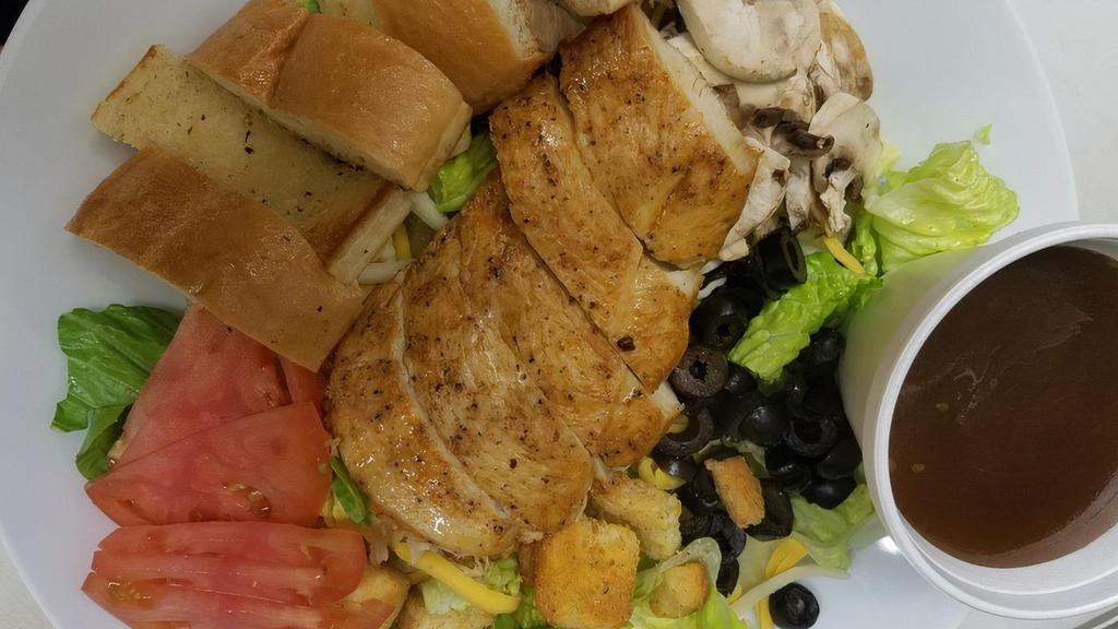 Chicken Caesar Salad · Chicken romaine, croutons and imported parmesan cheese shavings, tossed in our house Caesar. Served with garlic bread.