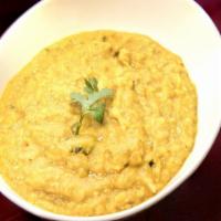 Yellow Dal (V) · Vegetarian. 
Yellow lentils cooked with onions, tomatoes, and spices.Served with rice.