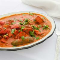 Chicken Tikka Masala · Chicken tikka cooked in fresh tomato sauce simmered in traditional masala sauce. Served with...