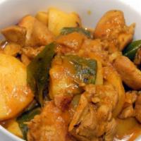 Chicken Vindaloo · Tender chicken pieces cooked hot and spicy with potato cubes and fresh coriander. Served wit...