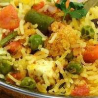Vegetable Biryani · Mixed vegetables delicately sautéed with Indian basmati rice. Garnished with homemade cheese...
