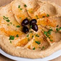 Large Hummus · House blended garbanzo beans, tahini, olive oil, fresh garlic, lemon juice, and our special ...