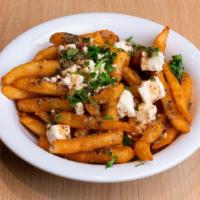 Greek Fries · Our crispy fries topped with feta cheese, and homemade sauce. They are simply irresistible.