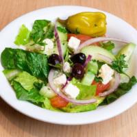 Side Greek Salad · Romaine Hearts, Tomatoes, Cucumbers, Red Onions, Feta Cheese, Olives, Pepperchine, and Homem...
