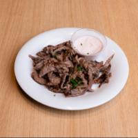 Side Steak Shawarma · Thinly sliced steak, marinated and flame broiled on a vertical skewer. Served with garlic sa...