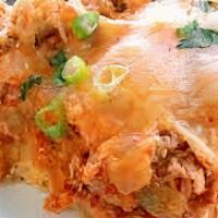 Enchilado Tamale · Choice of chicken, pork, jalapeno or sweet corn tamale covered with red or green salsa and t...