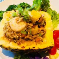Pineapple Fried Rice · Stir fried chicken and prawn with fresh pineapple, onion, pea and carrot, cashew nut with ye...