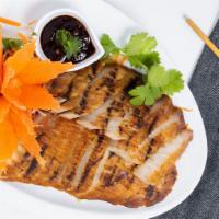 Bbq Pork · BBQ pork marinated with Thai herbs and served with spicy soy sauce.