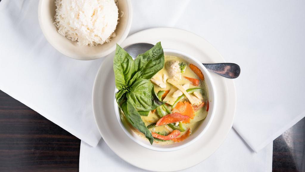 Green Curry · Spicy. Spicy green curry with bamboo shoots, bell peppers, onions and jalapeños. Served with rice.