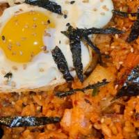 Kimchi Fried Rice · Spicy. Fresh homemade kimchi stir fried with rice, spam topped with fried egg.