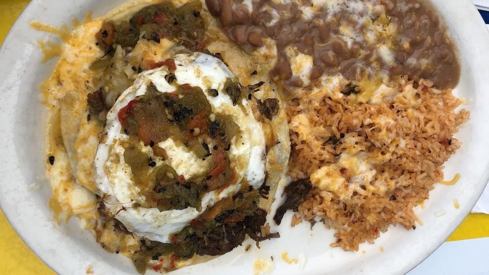 Frank'S Enchilada Plate · Three thick hand made tortillas, lettuce and tomato, garnish with egg and two sopapillas, beans, and rice.