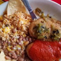 Chile Relleno Plate · Hot. Two new Mexico green chilies stuffed with cheese, topped with poblano sauce, beans, and...