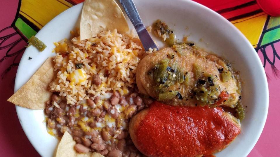 Chile Relleno Plate · Hot. Two new Mexico green chilies stuffed with cheese, topped with poblano sauce, beans, and rice.