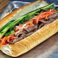 All Natural Steak Banh Mi · French inspired Vietnamese baguette w/mayo, pickled daikon & carrots, cucumber, cilantro & j...