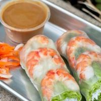 Shrimp Spring Rolls (Gf) · Rice wraps with vermicelli, green lettuce, iceberg lettuce, mints, and wild gulf shrimps.
