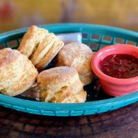 Biscuit Basket  · Four mini-biscuits served with  butter and berry jam.