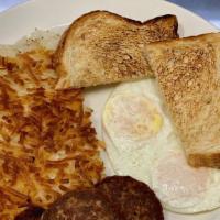 Two Egg Breakfast · Two eggs, choice of bacon or veggie sausage, hashbrowns & toast