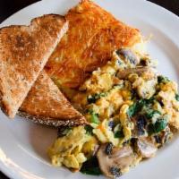 Ed'S Plate Scramble · Three eggs scrambled with cheddar, mushrooms, spinach & roasted garlic. Served with hashbrow...