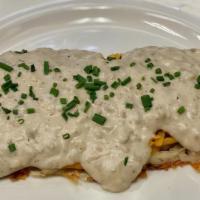 Loaded Hashbrowns · Hashbrowns topped with cheddar cheese, our signature vegetarian sausage gravy and topped wit...