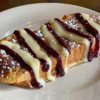 Grand Marnier French Toast · Three slices of braided challah dipped in Grand Marnier infused batter, then grilled. Topped...