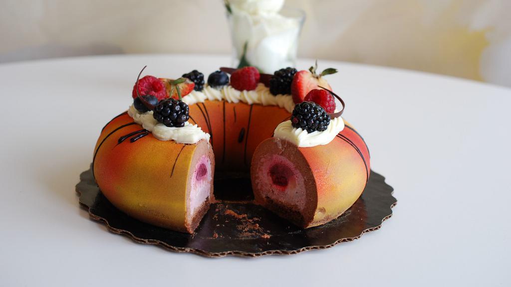 Raspberry Chocolate Slice · Contains: dairy, eggs, whole wheat (gluten). Raspberry jam layer with fresh berries and raspberry mousse, chocolate cream and chocolate cake.
