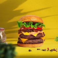 Double Trouble Impossible Burger · Two plant-based impossible meat patties topped with melted vegan cheddar cheese, grilled oni...