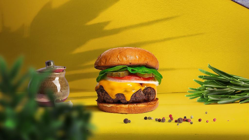 Cheese Biz Impossible Burger · Plant-based impossible meat patty topped with melted vegan cheddar cheese, grilled onions, mustard, house spread, dill pickles, lettuce, and tomato.