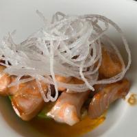 Salmon Belly · Spicy. Marinated salmon belly served with eel and habanero sauce. Spicy.