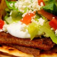 Gyro · Broiled then grilled sliced layers of seasoned beef and lamb, served with lettuce, tomatoes,...