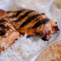Chicken · Marinated grilled chicken breast served on a bed of basmati rice, with a side of zesty garli...